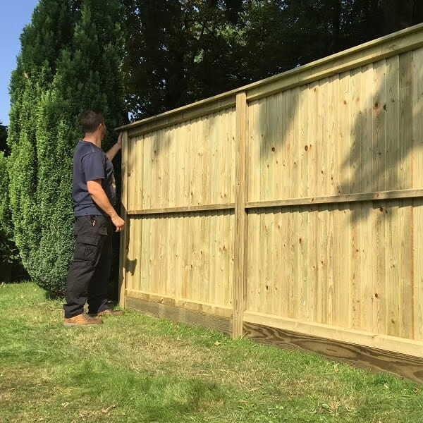 Local fencing company installing a wooden fence in Dublin