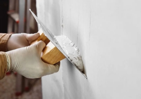Plasterer working on a wall in a Dublin home